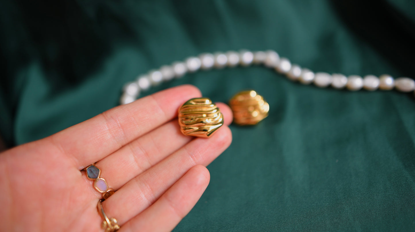 Gold earrings with a classic design