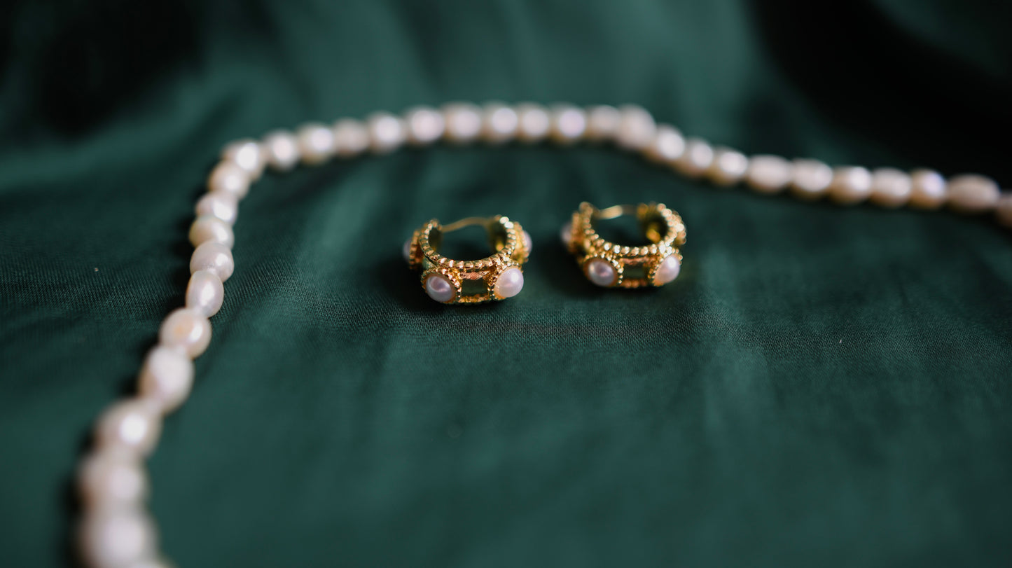 Gold earrings with pearl detail