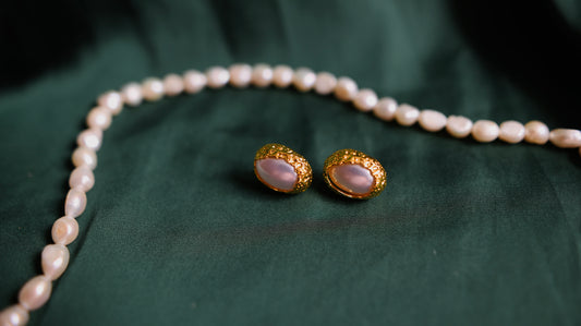Vintage-style gold earrings with a pearl