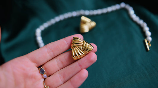 Gold earrings with a geometric design