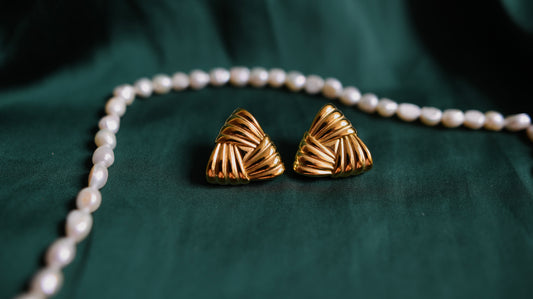 Gold earrings with a geometric design