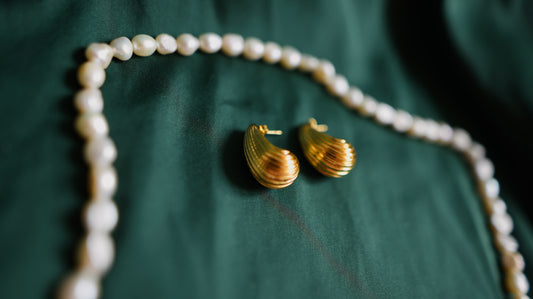 Gold earrings with a textured surface 