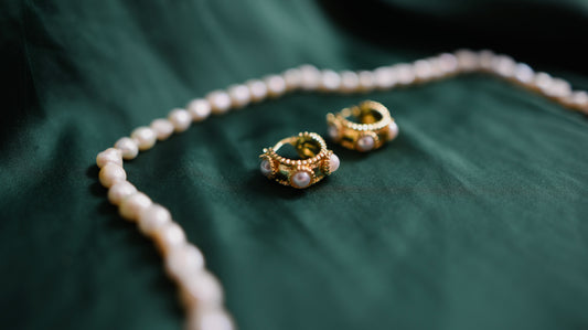 Gold earrings with pearl detail