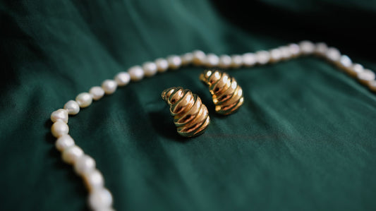 Gold earrings with a textured shape 