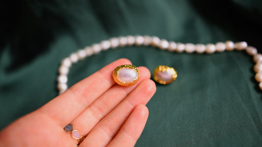 Vintage-style gold earrings with a pearl